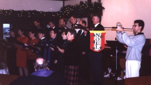 The Sr. Choir sings at Christmas, complete with herald trumpet accompaniment.